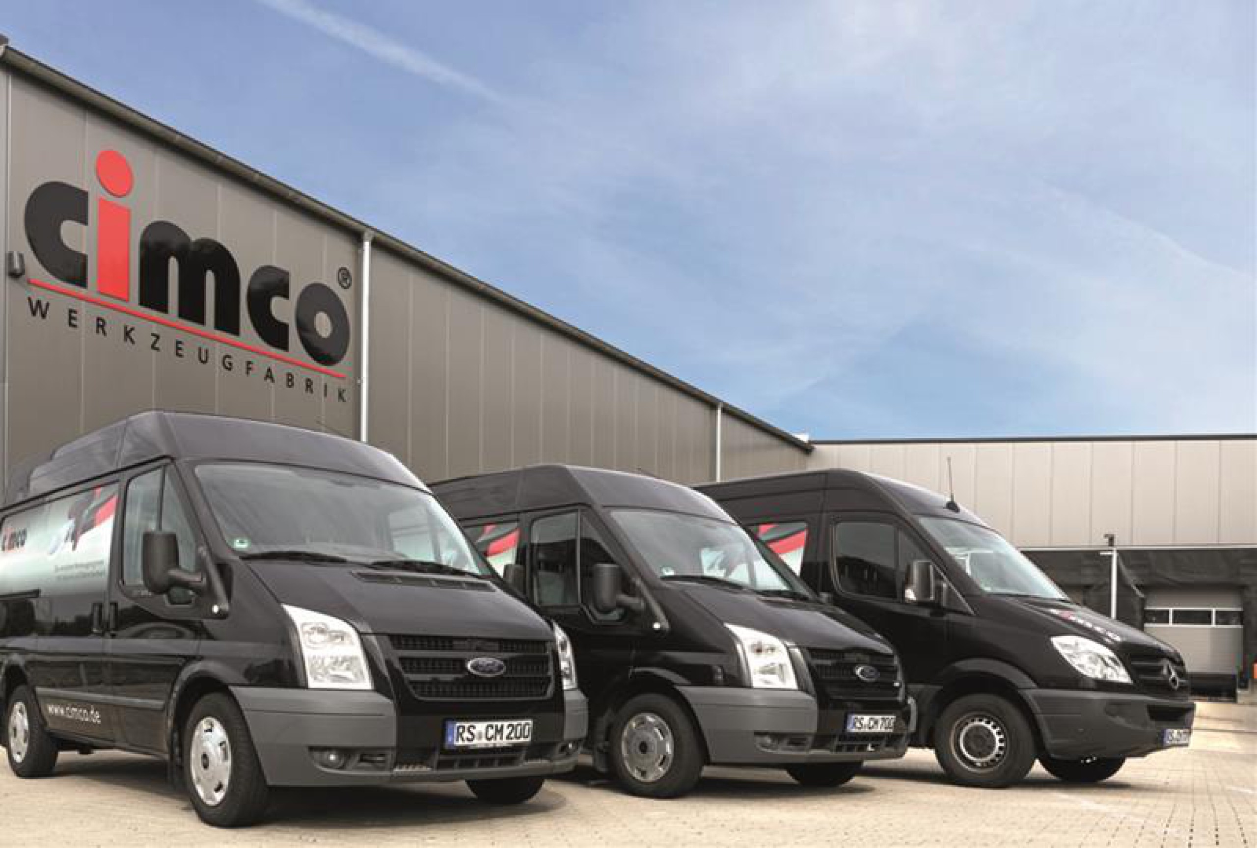 Cimco building and company vans